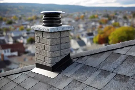 Stone chimney with new cap on a Rumson home